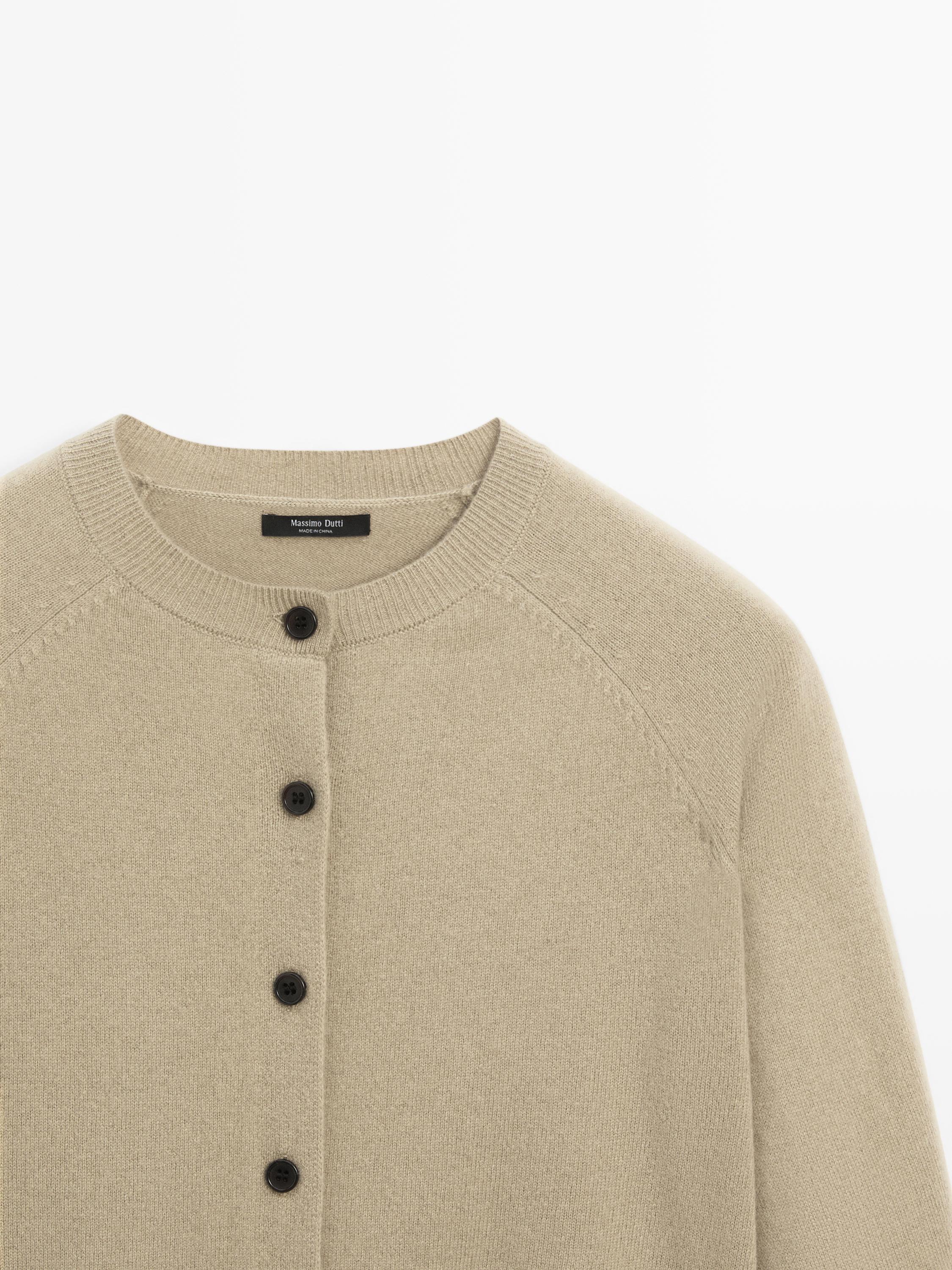 Short knit cardigan with raglan sleeves